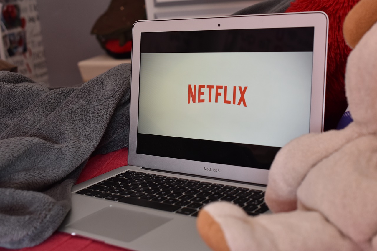 A picture of a laptop with the Netflix logo on it.